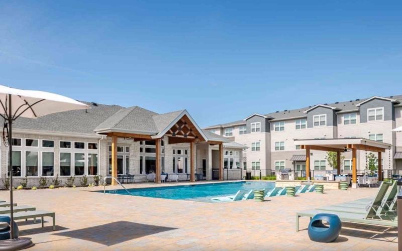a swimming pool in front of a building