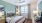 a bedroom with a bed and a fan